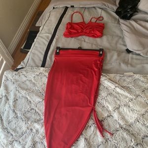 Red 2 piece outfit .I’m size small the skirt has a tie up on the side